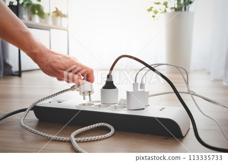 Power strip socket with connected plugs. 113335733