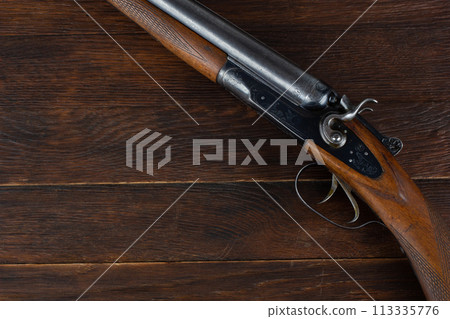 break action smooth bored double barreled side shotgun. 113335776