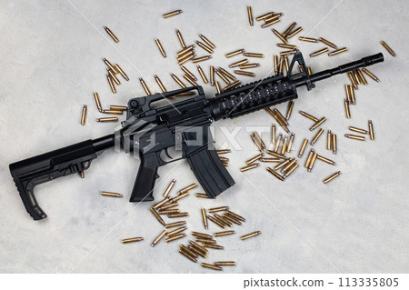M4 carbine and 5.56mm shells and magazine with bullets M4 carbine and 5.56mm shells and magazine with bullets 113335805