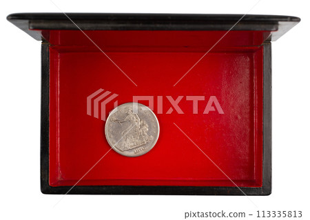 vintage old black and red casket with silver dollar coin 113335813