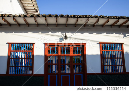 Beautiful facade of the houses at the historical downtown of the heritage town of Salamina located at the Caldas department in Colombia. Beautiful facade of the houses at the historical downtown of the heritage town of Salamina located at the Caldas department in Colombia. 113336234