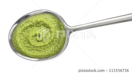 Broccoli cream soup in spoon isolated on white background. Top view Broccoli cream soup in spoon isolated on white background. Top view 113336736