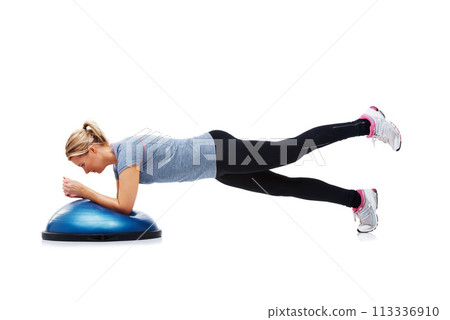 Woman, bosu ball and exercise or workout in studio, core strength and fitness challenge for wellness. Female person, athlete and equipment for training, healthy body and performance in sportswear Woman, bosu ball and exercise or workout in studio, core strength and fitness challenge for wellness. Female person, athlete and equipment for training, healthy body and performance in sportswear 113336910