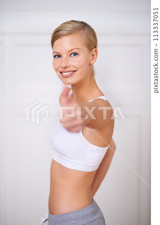 Happy woman, portrait and fitness with thumbs up for workout, exercise or training at home. Face of female person or yogi with smile, like emoji or yes sign for good job, success or winning at house Happy woman, portrait and fitness with thumbs up for workout, exercise or training at home. Face of female person or yogi with smile, like emoji or yes sign for good job, success or winning at house 113337051