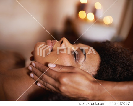 Black woman, closeup of hands on face and massage with masseuse, beauty and bodycare at spa for stress relief and wellness. Treatment, facial and healing for zen, self care and relax at luxury resort Black woman, closeup of hands on face and massage with masseuse, beauty and bodycare at spa for stress relief and wellness. Treatment, facial and healing for zen, self care and relax at luxury resort 113337097
