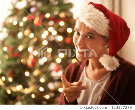 Christmas, portrait or woman for finger, warning or naughty in playful break in festive season. Gen z female person, red hat or smile to hey you, no or humor to relax in living room, tree and lights Christmas, portrait or woman for finger, warning or naughty in playful break in festive season. Gen z female person, red hat or smile to hey you, no or humor to relax in living room, tree and lights 113337279