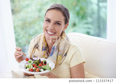 Woman, eating salad and food for diet, vegetables and lunch with happiness in portrait. Nutrition, wellness and healthy vegan meal for cholesterol with smile, detox and snack for dinner at home 113337417