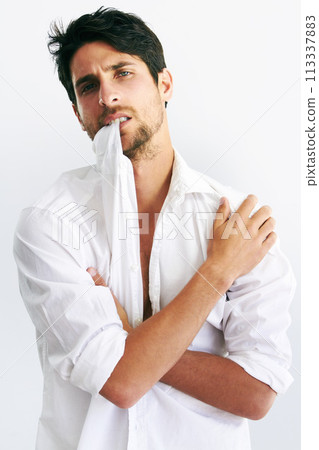 Portrait, fashion and man biting collar in studio isolated on a white background. Face, style and confidence of serious model, handsome and attractive person in trendy clothes, body or cool in Spain Portrait, fashion and man biting collar in studio isolated on a white background. Face, style and confidence of serious model, handsome and attractive person in trendy clothes, body or cool in Spain 113337883