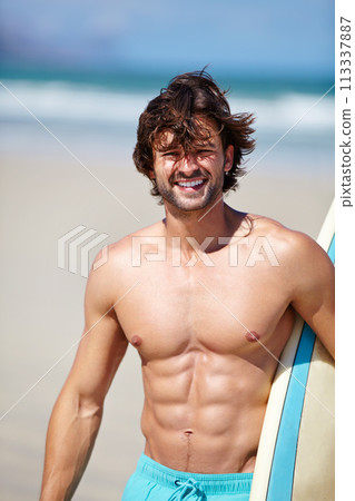 Beach portrait, surf and strong man on sports holiday adventure, travel vacation or nature freedom for fresh air. Surfing training, fitness or summer athlete ready for surfboard trip, journey or swim 113337887