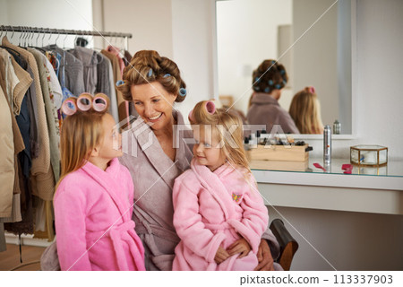 Hairstyle, home and grandmother with girls, conversation and fun with holiday, relax and weekend break. Family, dress up and granny with grandchildren and grooming with joy and holiday with happiness 113337903