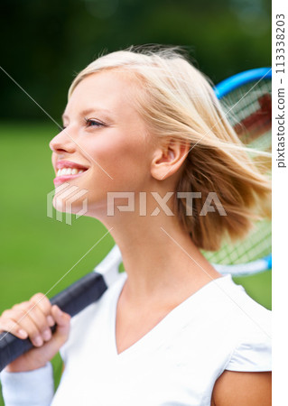 Tennis, woman and smile with racket outdoor for training to play match, contest and competition. Face of happy young athlete, sports player and thinking on court about practice for tournament game Tennis, woman and smile with racket outdoor for training to play match, contest and competition. Face of happy young athlete, sports player and thinking on court about practice for tournament game 113338203