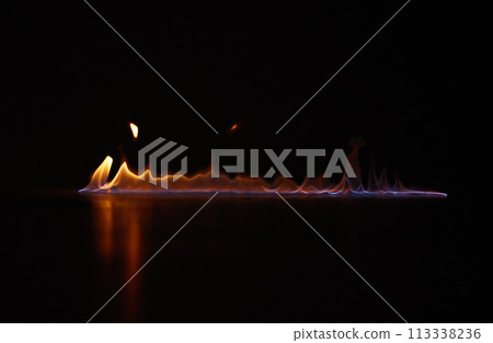 Flame, heat and gas fire with black background with sparks, smoke and light from burning in studio. Fuel, flare and glow from thermal power and art in the dark with creativity and inferno with burn 113338236