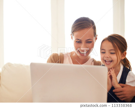 Laptop, education or elearning with mother and daughter on sofa in living room of home to study together. School, remote class or homework with woman parent and girl child in apartment for growth Laptop, education or elearning with mother and daughter on sofa in living room of home to study together. School, remote class or homework with woman parent and girl child in apartment for growth 113338368