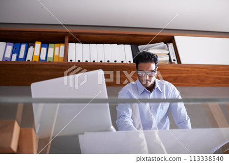 Thinking, documents and business man with laptop for internet, website and online project by desk. Professional architect, paperwork and worker with computer for floor plan, ideas and blueprint Thinking, documents and business man with laptop for internet, website and online project by desk. Professional architect, paperwork and worker with computer for floor plan, ideas and blueprint 113338540