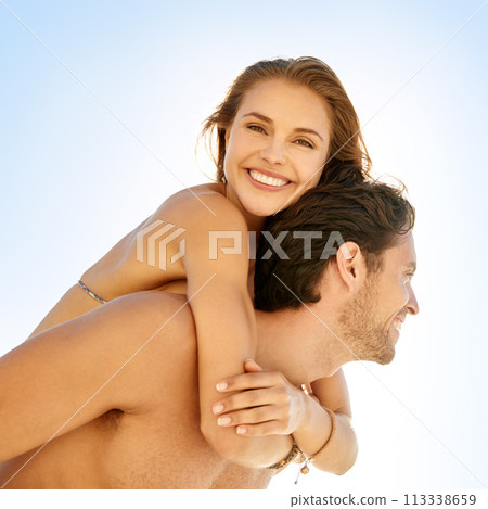 Happy, piggyback and couple at a beach with love, support and bonding on summer break. Travel, smile and people hug in nature with trust, care and having fun with back ride, adventure or date at sea 113338659