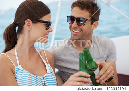 Smile, couple and toast with alcohol on yacht at sea in celebration of vacation, travel or summer holiday on ship. Man, woman or cheers with beer on boat outdoor for journey, cruise or drink at party Smile, couple and toast with alcohol on yacht at sea in celebration of vacation, travel or summer holiday on ship. Man, woman or cheers with beer on boat outdoor for journey, cruise or drink at party 113339194