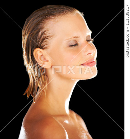 Shower, beauty and face of woman on black background for wellness, grooming and cosmetics. Satisfaction, luxury spa and happy person with eyes closed for skincare, washing and cleaning in studio 113339217