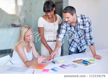 Teamwork, creative and business people planning at table in meeting, decision or collaboration in office startup. Happy group, designer and color swatches on picture or brainstorming palette together Teamwork, creative and business people planning at table in meeting, decision or collaboration in office startup. Happy group, designer and color swatches on picture or brainstorming palette together 113339276