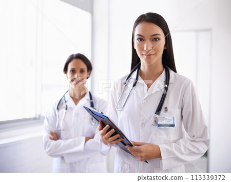 Portrait, doctors and leader with medical team in hospital for health checklist in clinic. Face, women and surgeon with arms crossed in collaboration for wellness, cooperation or confidence together 113339372