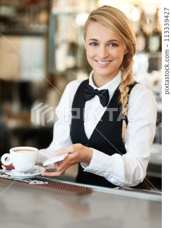 Coffee, barista and portrait of woman waiter in cafe making a latte, espresso or cappuccino at an event. Hospitality, server and female employee preparing a warm beverage in cup by a bar restaurant Coffee, barista and portrait of woman waiter in cafe making a latte, espresso or cappuccino at an event. Hospitality, server and female employee preparing a warm beverage in cup by a bar restaurant 113339427