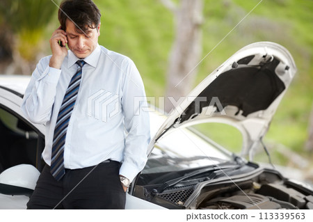 Roadside assistance, phone call and business man by car in conversation, travel or journey. Smartphone, help and serious person with engine breakdown, transportation insurance and emergency support 113339563