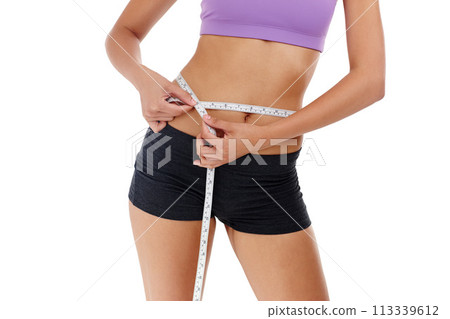 Health, fitness and woman with measuring tape for waist, weight goal with diet and exercise on white background. Stomach, body and wellness, check progress for weightloss and measurement in studio 113339612