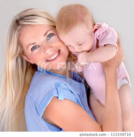 Mother, child and smiling in portrait and embrace, bonding and security in connection at home. Mommy, daughter and happy while hugging on weekend, caring and family or affection or satisfaction 113339710