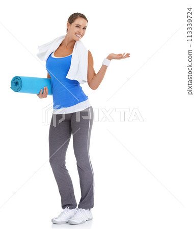 Yoga mat, hand and portrait of woman in studio with mockup space for exercise or workout. Happy, equipment and young female person with show gesture for fitness or sports isolated by white background Yoga mat, hand and portrait of woman in studio with mockup space for exercise or workout. Happy, equipment and young female person with show gesture for fitness or sports isolated by white background 113339724