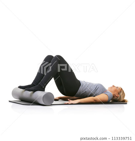 Core workout, foam roller and studio woman with bridge exercise, activity or wellness for sports performance on floor. Ground, mockup space and girl fitness, training and yoga mat on white background Core workout, foam roller and studio woman with bridge exercise, activity or wellness for sports performance on floor. Ground, mockup space and girl fitness, training and yoga mat on white background 113339751