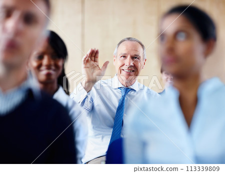 Senior businessman, meeting and question in seminar for interaction or collaboration at office. Happy mature man with hands raised for answer, idea or solution in team conference or staff training 113339809