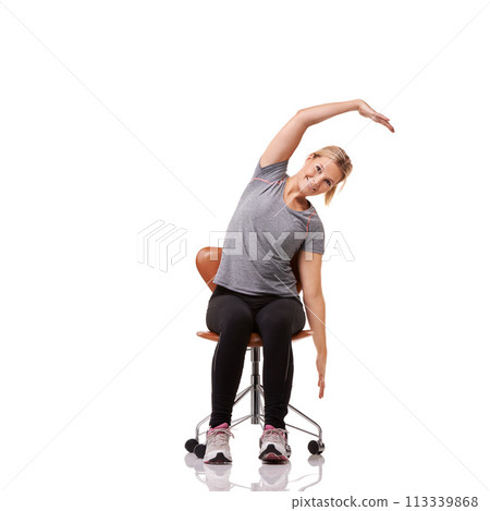 Office, chair and portrait of woman stretching for posture, health and fitness in white background or studio. Sitting, exercise and person training with seated arm stretches or practice for wellness 113339868