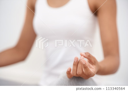 Woman, hands and meditation for yoga, zen or exercise in spiritual wellness or inner peace at home. Closeup of calm female person or yogi meditating in relax for awareness or mental health at house Woman, hands and meditation for yoga, zen or exercise in spiritual wellness or inner peace at home. Closeup of calm female person or yogi meditating in relax for awareness or mental health at house 113340564