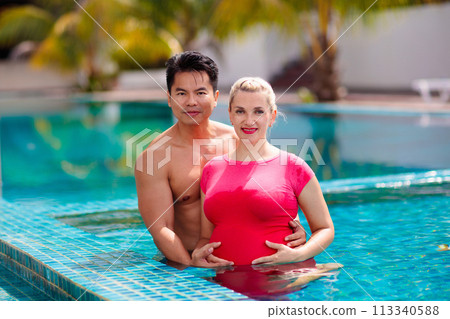 Pregnant woman. Interracial couple expecting baby. 113340588