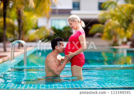 Pregnant woman. Interracial couple expecting baby. Pregnant woman. Interracial couple expecting baby. 113340591