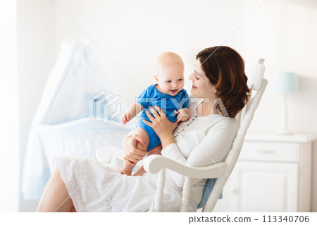 Happy young mother with baby boy at home 113340706