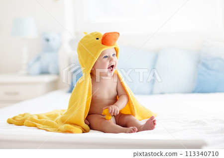 Cute baby after bath in yellow duck towel 113340710