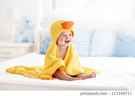 Cute baby after bath in yellow duck towel 113340711