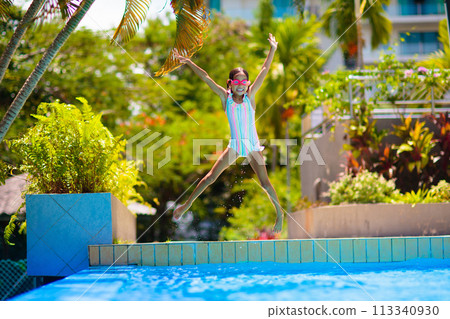 Child in swimming pool on ring toy. Kids swim. Child in swimming pool on ring toy. Kids swim. 113340930