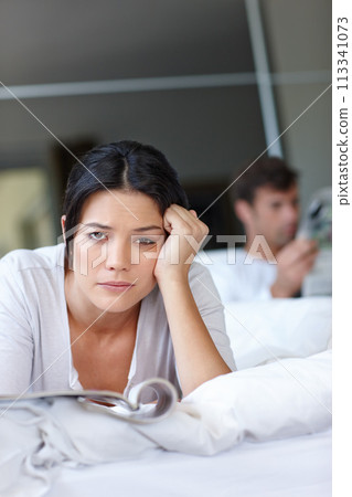 Woman, bored and bed with magazine and boyfriend for couple, problem or breakup for argument in home. Mexican female person and sad with book on blanket for stress, relationship and frustrated Woman, bored and bed with magazine and boyfriend for couple, problem or breakup for argument in home. Mexican female person and sad with book on blanket for stress, relationship and frustrated 113341073
