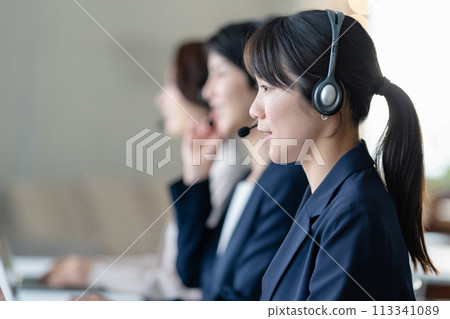 Female operator working at a call center Female operator working at a call center 113341089