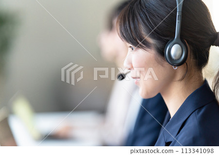 Female operator working at a call center 113341098