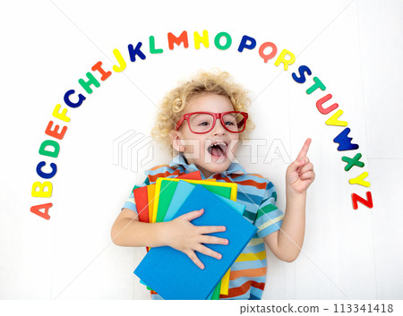Child learning letters of alphabet and reading 113341418