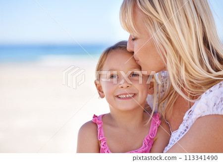 Smile, mother and kiss kid at beach on holiday, summer or love on vacation at sea. Face, mom and happy girl at ocean for adventure, travel and family bonding together outdoor in nature on mockup 113341490