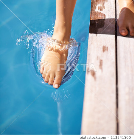 Wet, feet and pool in splash, outdoor and backyard for summer day and relaxation to swim in heat. Toes, outside and wet in holiday, backyard and resort for fun in the sun on vacation at home 113341500