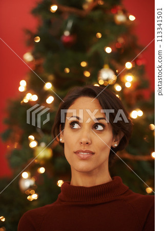 Christmas, tree and woman in home thinking of festive holiday and planning decoration event on vacation. Happy, girl and excited for xmas in winter and ideas for house with traditional aesthetic 113341501
