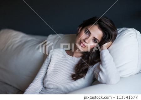 Portrait, woman and couch with break, confidence and style with lounge or sofa. Person, sweater and proud with elegant, relaxation and rest with youth and face in living room at house or home 113341577