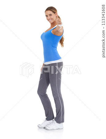 Happy woman, portrait and thumbs up for fitness, good job or winning on a white studio background. Active female person smile with like emoji, yes sign or OK in approval on mockup space for success 113341608