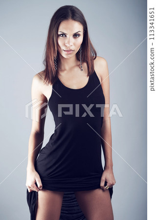 Confident, woman and portrait for fashion in studio on gray background with elegant dress or formal style. Luxury, clothes and model in trendy, fancy and edgy outfit with pride in classic aesthetic 113341651