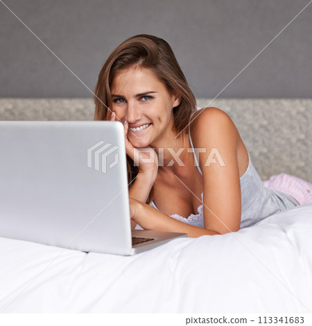 Portrait, woman and happy with laptop on bed, weekend and relax with online movies in home. Young lady, smile face and rest on bed with computer and streaming subscription or social media in house Portrait, woman and happy with laptop on bed, weekend and relax with online movies in home. Young lady, smile face and rest on bed with computer and streaming subscription or social media in house 113341683