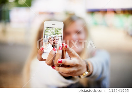 Selfie, phone screen and happy festival friends, women or people smile for fun bonding, social gathering or memory picture. Event picture, cellphone photography or girl hands post to social media app 113341965